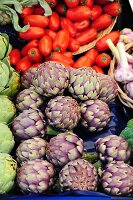 Artichokes and tomatoes on a market stall