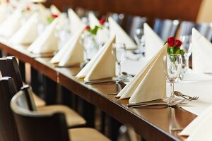 A table laid for a wedding reception in a restaurant