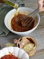 Spicy sauce being made for beef tatar