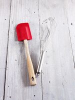 A spatula and a whisk