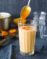 An apricot smoothie made with buttermilk and cinnamon