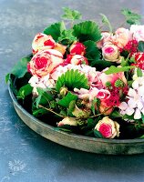 Flower arrangement with pink hydrangeas & blackberries
