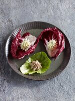 Various homemade spreads served in lettuce leaves