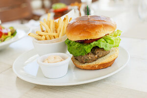 A hHamburger with fries in a cafe in South Beach, Miami, Florida