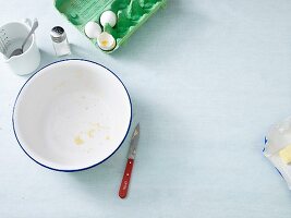 Dough being made: a used bowl and the remains of ingredients