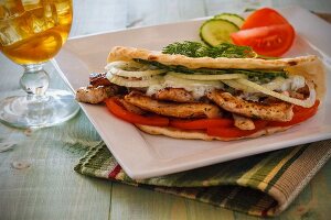 Chicken gyros with onions and tomatoes in pita bread