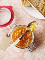 A jar of marmalade with a spoon