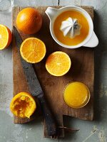 Freshly pressed orange juice and oranges