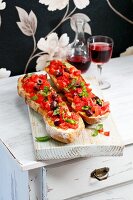 Baguette bruschetta with tomatoes and olives