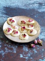 White chocolate rounds decorated with petals