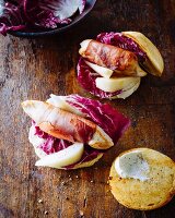 A burger with pears, bacon and radicchio