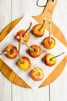 Toffee apples on a piece of baking paper