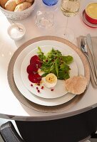 Baked goat's cheese with beetroot and mixed leaf salad with pomegranate seeds
