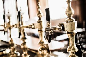 Old fashioned taps in the traditional pub Anno 1905 in Hamburg