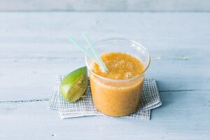 Pineapple and cataloupe smoothie with mango, kiwi and dried cranberries