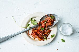 Purple carrot salad with dried apricots and a ginger dressing