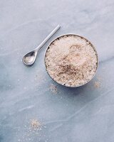 Porcini mushroom salt in a bowl with a spoon (seen from above)