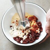 Ingredients for kidney bean burgers being puréed