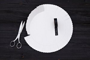 A white paper cake tray for wrapping a present