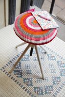 Stool with hand-crafted decorative cover