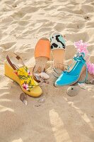 Various types of espadrilles on a beach