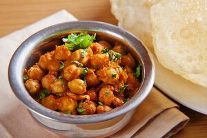 Chole bhatura (spicy chickpeas with fried bread, India)