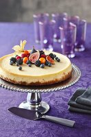 Berry cheesecake on a silver cake stand