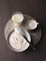 An arrangement of various soya products: soya milk, soya cream and soya yoghurt