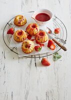 Mini lemon Bundt cakes with strawberry sauce