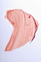 Light-pink lipstick on a white surface