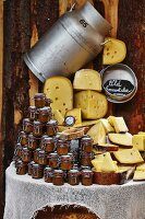 A cheese stand with a large milk churn