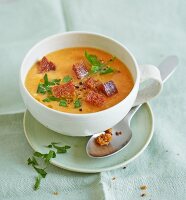 Cold carrot and almond soup with croutons and parsley