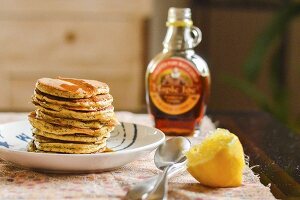 A stack of pancakes with maple syrup
