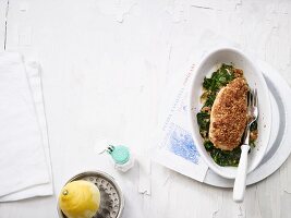 Crispy lemon chicken on a bed of spinach (low carb)