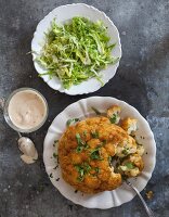 A whole baked cauliflower with a chilli and almond mayonnaise served with cos lettuce salad