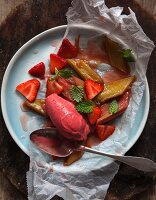 Vegan vanilla and strawberry ice cream with steamed rhubarb