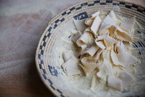 Handmade pasta with flour in a basket bowl