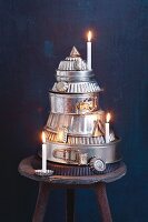 A Christmas tree made from old metal baking tins