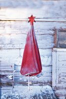 Parasol Christmas tree dusted with snow and decorated with a star