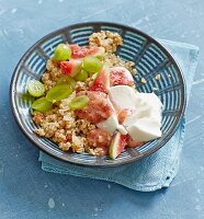 Quinoa muesli with fresh figs, grapes and soured milk