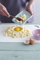 Gluten-free ingredients for making shortcrust pastry piled on a work surface