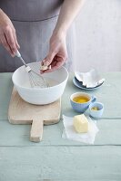 Ingredients for making gluten-free yeast dough being placed in a bowl