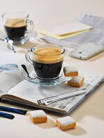 Coffee and cakes on a notebook