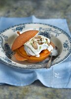 Apricot dessert with vanilla ice cream and nuts