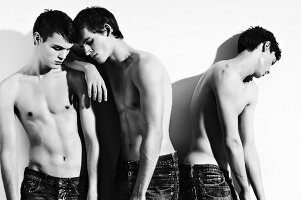 Three bare-chested young men (black and white photo)