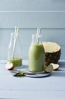 Wheatgrass and pineapple smoothies with apples and avocado