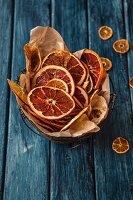 Dried orange slices in a wire basket