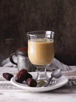 A date and orange smoothie with avocado and cocoa