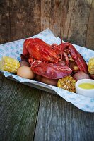 Cooked lobster with corn cobs and potatoes