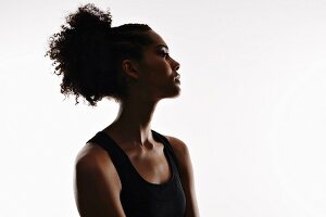 A young woman wearing a black tank top